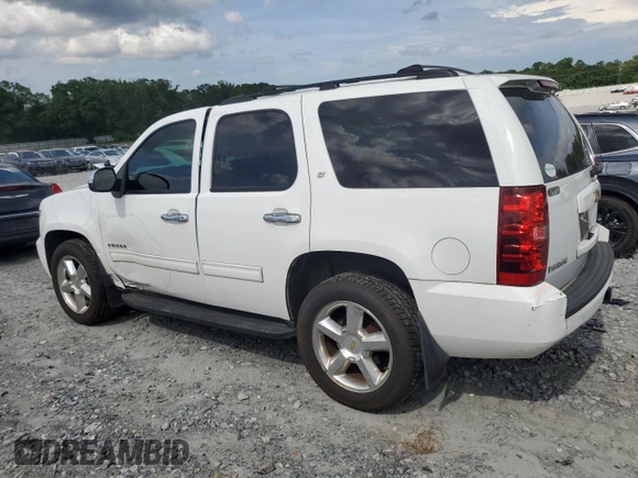 2011 Chevrolet Tahoe LS with VIN 1GNSCAE08BR394917, listed as a Copart auction lot 60470395 with 143,824 mi miles and Salvage title. Bid and sale history available at DreamBid. Image 2.