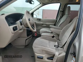 2003 Ford Windstar SE with VIN 2FMDA52413BB59104, listed as a Copart auction lot 55134805 with 132,918 mi miles and Salvage title. Bid and sale history available at DreamBid. Image 7.