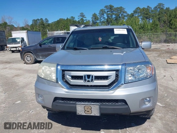 2011 Honda Pilot Touring with VIN 5FNYF4H91BB086712, listed as a IAAI auction lot 41809369 with 260,718 mi miles. Bid and sale history available at carsss.com. Image 12.