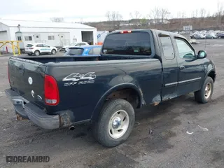 2000 Ford F-150 XL with VIN 1FTRX18WXYNC25817, listed as a IAAI auction lot 41976618 with 148,794 mi miles. Bid and sale history available at carsss.com. Image 4.