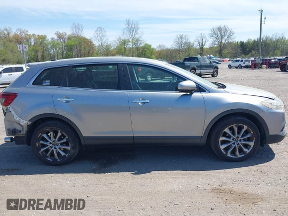 2014 Mazda CX-9 Grand Touring z VIN JM3TB3DV4E0429428, wystawiony jako IAAI lot #42094028 z przebiegiem 147 294 mil mil oraz . Historia ofert i sprzedaży dostępna na DreamBid. Obrazek 13.