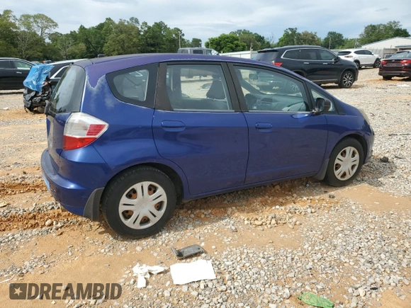 2009 Honda Fit with VIN JHMGE882X9S007865, listed as a Copart auction lot 61025875 with 159,919 mi miles and Clean title. Bid and sale history available at DreamBid. Image 3.