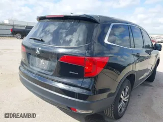 2017 Honda Pilot EX-L with VIN 5FNYF5H5XHB040842, listed as a IAAI auction lot 41778935 with 151,464 mi miles. Bid and sale history available at carsss.com. Image 4.