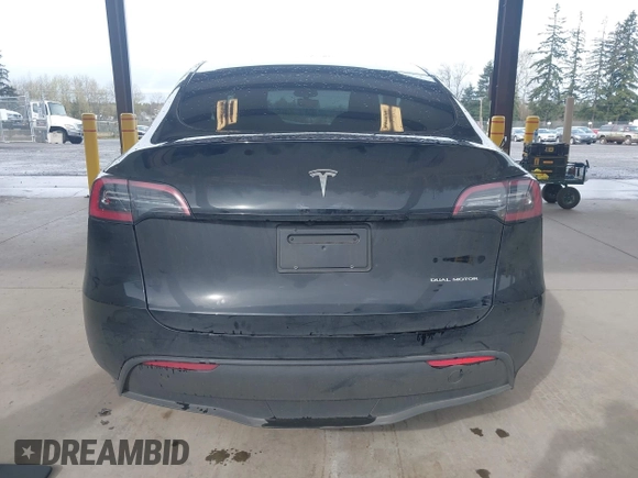 2023 Tesla Model Y Long Range with VIN 7SAYGDEE0PF909610, listed as a IAAI auction lot 41906081 with 20,656 mi miles and . Bid and sale history available at DreamBid. Image 17.