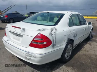 2003 Mercedes-Benz E-Class 3.2L with VIN WDBUF65J23A120318, listed as a IAAI auction lot 41927993 with 113,578 mi miles. Bid and sale history available at carsss.com. Image 4.