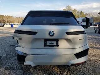 2025 BMW iX xDrive50 with VIN WB523CF0XSCS62033, listed as a Copart auction lot 42503325 with 7,294 mi miles and Salvage Title. Bid and sale history available at carsss.com. Image 6.