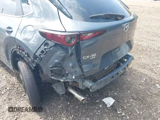 2023 Mazda CX-30 S Preferred z VIN 3MVDMBCM4PM558181, wystawiony jako IAAI lot #42589333 z przebiegiem 12 384 mil mil oraz . Historia ofert i sprzedaży dostępna na DreamBid. Obrazek 6.