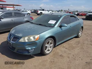 2009 Pontiac G6 1SB with VIN 1G2ZJ57K594261692, listed as a IAAI auction lot 42802373 with 200,469 mi miles and . Bid and sale history available at DreamBid. Image 2.
