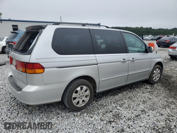 2004 Honda Odyssey EX-L with VIN 5FNRL18044B069774, listed as a Copart auction lot 57096535 with 165,307 mi miles and Salvage title. Bid and sale history available at DreamBid. Image 3.