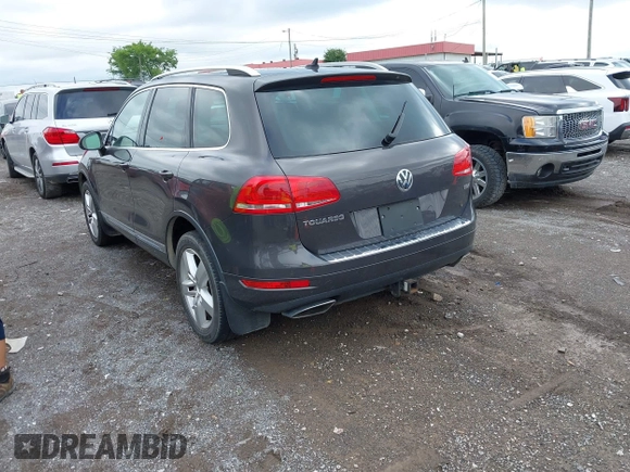 2012 Volkswagen Touareg Sport with VIN WVGFK9BP0CD002939, listed as a IAAI auction lot 42531654 with 222,435 mi miles and . Bid and sale history available at DreamBid. Image 3.