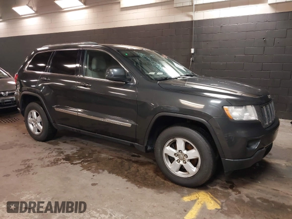 2011 Jeep Grand Cherokee 70th Anniversary with VIN 1J4RR4GG3BC566690, listed as a IAAI auction lot 41810545 with 173,886 mi miles. Bid and sale history available at carsss.com. Image 1.