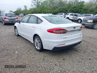 2020 Ford Fusion SE with VIN 3FA6P0LU5LR151074, listed as a IAAI auction lot 42146290 with 98,574 mi miles and . Bid and sale history available at carsss.com. Image 3.