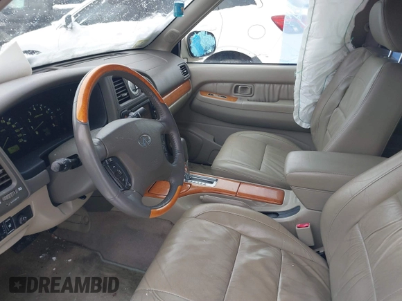 2002 Infiniti QX4 Luxury z VIN JNRDR09Y02W256431, wystawiony jako IAAI lot #41528658 z przebiegiem 76 077 mil mil oraz . Historia ofert i sprzedaży dostępna na DreamBid. Obrazek 5.