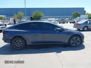 2023 Tesla Model 3 with VIN 5YJ3E1EAXPF405588, listed as a IAAI auction lot 42348952 with 30,788 mi miles and . Bid and sale history available at DreamBid. Image 14.