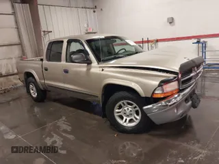 2004 Dodge Dakota SLT with VIN 1D7HL48N04S536819, listed as a IAAI auction lot 41210798 with 140,965 mi miles. Bid and sale history available at carsss.com. Image 1.