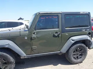2015 Jeep Wrangler Sport with VIN 1C4AJWAGXFL650428, listed as a IAAI auction lot 42010629 with 80,039 mi miles. Bid and sale history available at carsss.com. Image 17.