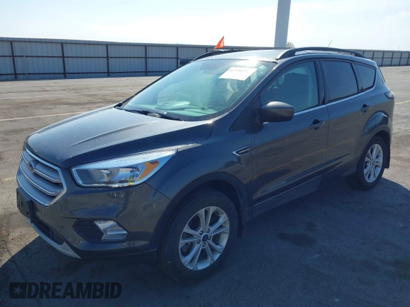 2018 Ford Escape SE z VIN 1FMCU9GD6JUD55937, wystawiony jako IAAI lot #41898592 z przebiegiem 37 800 mil mil oraz . Historia ofert i sprzedaży dostępna na DreamBid. Obrazek 18.
