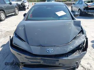 2024 Toyota Prius LE z VIN JTDACAAU4R3023781, wystawiony jako IAAI lot #42114520 z przebiegiem 20 884 mil mil oraz . Historia ofert i sprzedaży dostępna na DreamBid. Obrazek 12.
