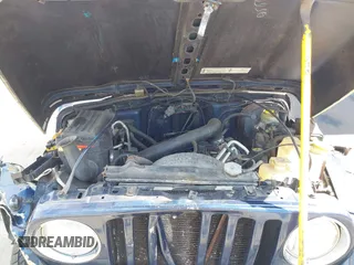 2000 Jeep Wrangler Sport with VIN 1J4FA49S5YP750123, listed as a IAAI auction lot 42060009 with Not Provided miles. Bid and sale history available at carsss.com. Image 10.