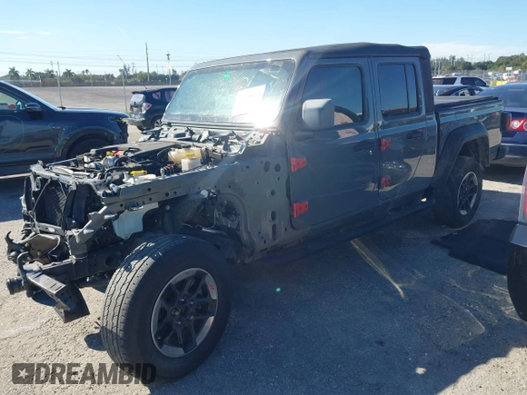2021 Jeep Gladiator Willys with VIN 1C6HJTAG4ML517715, listed as a IAAI auction lot 41436634 with 21,187 mi miles and . Bid and sale history available at DreamBid. Image 2.