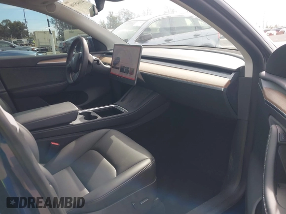 2022 Tesla Model Y Long Range with VIN 7SAYGDEE0NA019067, listed as a IAAI auction lot 41645198 with 49,336 mi miles and . Bid and sale history available at DreamBid. Image 5.