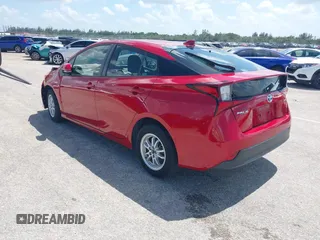 2021 Toyota Prius L Eco with VIN JTDKAMFU4M3145215, listed as a IAAI auction lot 42281566 with 74,220 mi miles and . Bid and sale history available at DreamBid. Image 3.