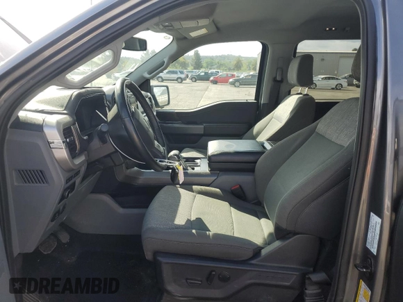 2023 Ford F-150 Lightning Pro with VIN 1FT6W1EV0PWG34788, listed as a Copart auction lot 54454805 with 11,432 mi miles and Salvage title. Bid and sale history available at DreamBid. Image 7.