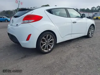 2014 Hyundai Veloster with VIN KMHTC6ADXEU213073, listed as a IAAI auction lot 41551346 with 130,549 mi miles. Bid and sale history available at carsss.com. Image 4.