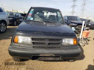 1998 Suzuki Sidekick JS z VIN 2S3TE02V1W6402490, wystawiony jako Copart lot #78316244 z przebiegiem 79 724 mil mil oraz Tytuł czysty. Historia ofert i sprzedaży dostępna na DreamBid. Obrazek 5.