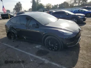2024 Tesla Model Y Long Range with VIN 7SAYGDEE5RF060707, listed as a Copart auction lot 87288784 with Not provided miles and Salvage title. Bid and sale history available at DreamBid. Image 4.