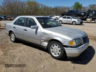 1995 Mercedes-Benz C with VIN WDBHA28E7SF255142, listed as a Copart auction lot 68411704 with 334,000 mi miles and Salvage Title. Bid and sale history available at carsss.com. Image 4.