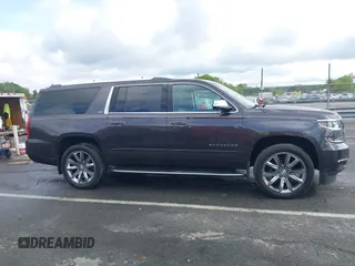 2015 Chevrolet Suburban LTZ with VIN 1GNSKKKC4FR589913, listed as a IAAI auction lot 42017190 with 216,145 mi miles. Bid and sale history available at carsss.com. Image 13.