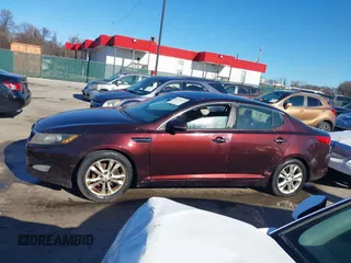 2013 Kia Optima LX z VIN 5XXGM4A71DG186111, wystawiony jako IAAI lot #41189410 z przebiegiem 214 084 mil mil oraz . Historia ofert i sprzedaży dostępna na DreamBid. Obrazek 14.