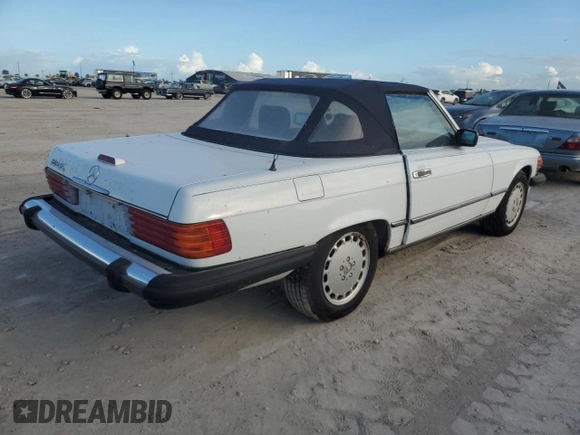 1989 Mercedes-Benz 560 SL z VIN WDBBA48DXKA096297, wystawiony jako Copart lot #75597074 z przebiegiem 70 152 mil mil oraz Szkoda całkowita • Salvage title. Historia ofert i sprzedaży dostępna na DreamBid. Obrazek 3.