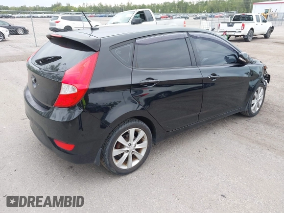 2013 Hyundai Accent SE with VIN KMHCU5AE8DU109616, listed as a IAAI auction lot 42051364 with 96,739 mi miles. Bid and sale history available at carsss.com. Image 4.