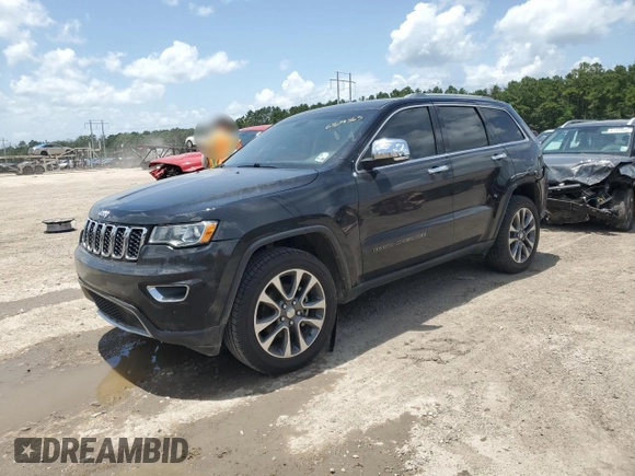 2018 Jeep Grand Cherokee Sterling z VIN 1C4RJEBG4JC241944, wystawiony jako Copart lot #61679565 z przebiegiem 83 480 mil mil oraz Szkoda całkowita • Salvage title. Historia ofert i sprzedaży dostępna na DreamBid. Obrazek 1.