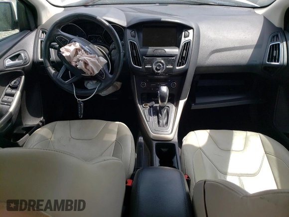 2015 Ford Focus Titanium z VIN 1FADP3N24FL262321, wystawiony jako Copart lot #59635525 z przebiegiem Nie podano mil oraz Szkoda całkowita • Salvage title. Historia ofert i sprzedaży dostępna na DreamBid. Obrazek 8.
