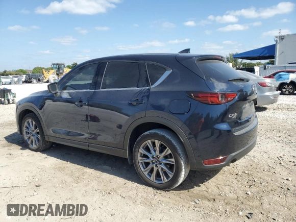 2021 Mazda CX-5 Grand Touring with VIN JM3KFBDM4M1462570, listed as a Copart auction lot 54827675 with 45,389 mi miles and Salvage Title. Bid and sale history available at DreamBid. Image 2.