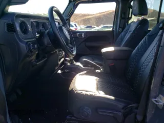 2023 Jeep Wrangler Sport S with VIN 1C4HJXDG3PW602849, listed as a Copart auction lot 46718365 with 24,308 mi miles and Salvage Title. Bid and sale history available at DreamBid. Image 7.