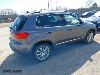 2012 Volkswagen Tiguan SE w/Sunroof & Nav with VIN WVGBV7AX4CW000207, listed as a IAAI auction lot 41889815 with 138,669 mi miles. Bid and sale history available at carsss.com. Image 4.