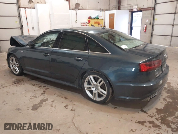 2016 Audi A6 2.0T Premium Plus with VIN WAUGFAFC8GN088505, listed as a IAAI auction lot 41569043 with 98,528 mi miles. Bid and sale history available at carsss.com. Image 3.