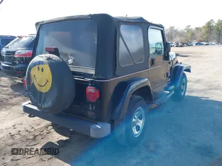 2003 Jeep Wrangler X with VIN 1J4FA39S53P362991, listed as a IAAI auction lot 41607212 with 240,556 mi miles. Bid and sale history available at carsss.com. Image 4.