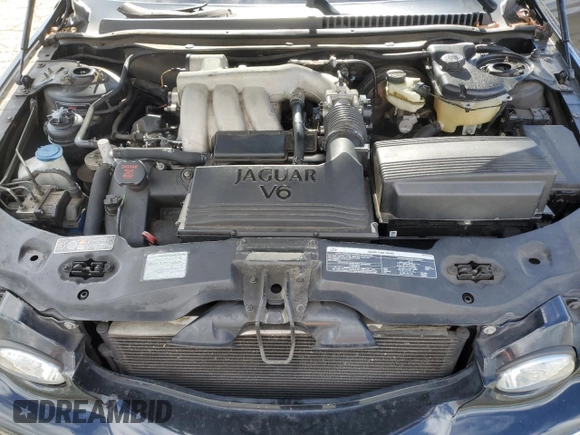 2004 Jaguar X-Type with VIN SAJEA51C74WD56736, listed as a Copart auction lot 48038295 with 115,817 mi miles and Salvage Title. Bid and sale history available at DreamBid. Image 11.