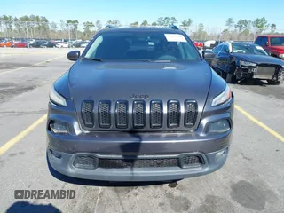 2014 Jeep Cherokee Latitude with VIN 1C4PJMCS3EW298340, listed as a IAAI auction lot 41708488 with 217,438 mi miles and . Bid and sale history available at DreamBid. Image 12.