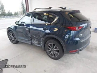 2018 Mazda CX-5 Grand Touring with VIN JM3KFBDM4J0302870, listed as a IAAI auction lot 41934217 with 57,151 mi miles. Bid and sale history available at carsss.com. Image 3.