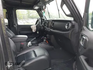 2021 Jeep Wrangler Unlimited Sahara with VIN 1C4JJXP60MW704738, listed as a IAAI auction lot 42042079 with 63,765 mi miles and . Bid and sale history available at DreamBid. Image 5.