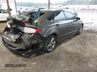 2015 Ford Fusion SE Hybrid with VIN 3FA6P0LU6FR248904, listed as a IAAI auction lot 41556607 with 224,799 mi miles. Bid and sale history available at carsss.com. Image 4.