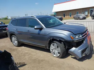 2019 Volkswagen Atlas SEL z VIN 1V2ER2CA5KC555568, wystawiony jako IAAI lot #42050516 z przebiegiem 71 599 mil mil oraz . Historia ofert i sprzedaży dostępna na DreamBid. Obrazek 13.