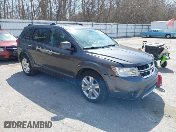 2014 Dodge Journey Limited with VIN 3C4PDDDG7ET138601, listed as a IAAI auction lot 42021766 with 214,220 mi miles and . Bid and sale history available at carsss.com. Image 1.