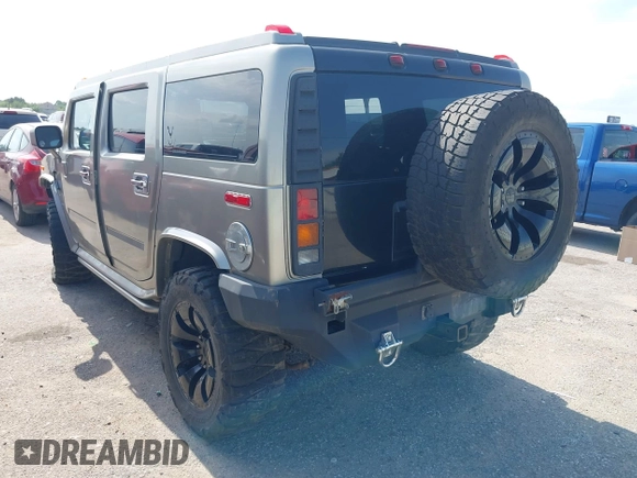 2004 Hummer H2 z VIN 5GRGN23U34H105809, wystawiony jako IAAI lot #42456055 z przebiegiem Nie podano mil oraz . Historia ofert i sprzedaży dostępna na DreamBid. Obrazek 3.